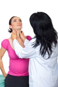 Endocrinologist checking tyroide woman